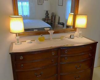 This is another dresser, underneath a wall mirror.  The pair of lamps is nice, too.