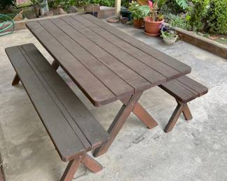 Outside, we have this large wooden picnic table.  It needs a bit of work, but likely has plenty of life left in it.