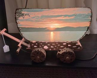 I said we'd get back to this lighted covered wagon model, and here we are.  The body and wheels are made at least partially by ocotillo wood.  The wagon cover is a beautiful sunset over a lake.