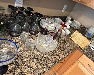 A lot of drinking glassware and China sets