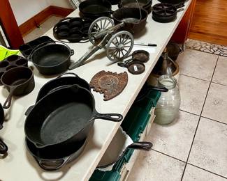 Vintage and antique cast iron pans, pots, trivets, dutch ovens