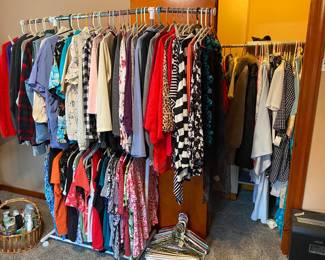 Women’s shirts some new with tags baskets of bathroom items