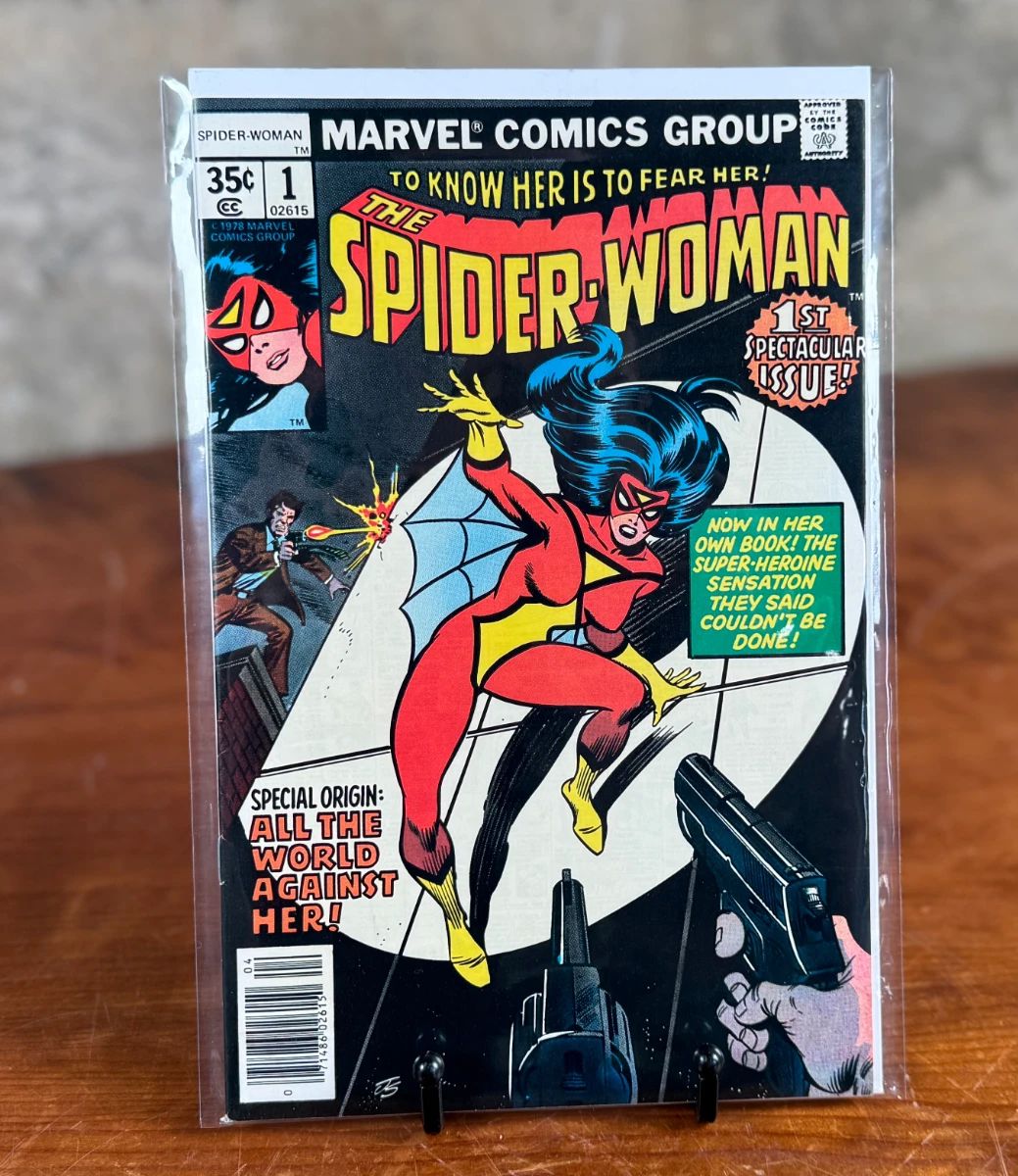 Marvel Comics Spider-Woman #1, published in 1978. Features the first appearance of Spider-Woman, Jessica Drew, with the tagline ‘To Know Her Is To Fear Her!’ in 35-cent price variant. The comic is bagged for preservation with visible front cover illustrations in vibrant multicolors.