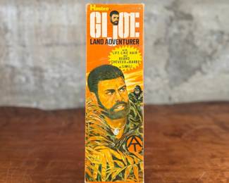Hasbro G.I. Joe Land Adventurer action figure with original box and accessories.