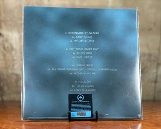 Factory-sealed copy of the album ’30,’ by Adele, signed on the cover in silver marker. Includes a tamper-proof holographic Heritage Authentication sticker and certificate of authenticity. Signature is clear and located on the artwork. A collectible for music enthusiasts.