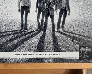 Promotional poster for Bad Company’s album ‘Burnin’ Sky, ’ featuring a black-and-white design with the band’s image and album title. The poster measures 16.5” H x 23” W.