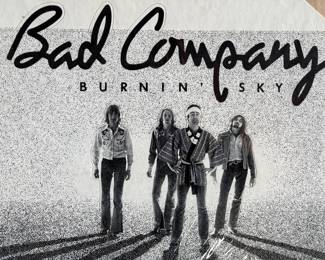 Promotional poster for Bad Company’s album ‘Burnin’ Sky, ’ featuring a black-and-white design with the band’s image and album title. The poster measures 16.5” H x 23” W.