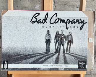 Promotional poster for Bad Company’s album ‘Burnin’ Sky, ’ featuring a black-and-white design with the band’s image and album title. The poster measures 16.5” H x 23” W.