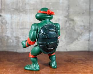 1989 Playmates Toys Teenage Mutant Ninja Turtles action figure representing Michelangelo.