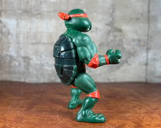1989 Playmates Toys Teenage Mutant Ninja Turtles action figure representing Michelangelo.