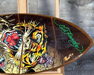 Ed Hardy skimboard featuring bold tiger-themed artwork and vibrant illustrations in signature style. Measures 40” H x 17.5” W and includes ’50-150 Weight Class’ labeling.