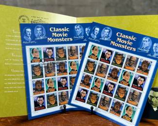 Classic Movie Monsters stamp collection commemorating iconic Hollywood characters. Includes a presentation folder with informational text and two sheets of stamps depicting monsters such as Dracula, Frankenstein, and more. Stamped with an issue date of September 30, 1997, at Universal City, California.