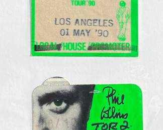 Items from Mötley Crüe’s World Tour (1987-89), including two crew wristbands, one yellow and one red, and a backstage pass patch labeled ‘Working Personnel.’ Mounted on display with handwritten notes documenting their origin.