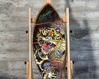 Ed Hardy skimboard featuring bold tiger-themed artwork and vibrant illustrations in signature style. Measures 40” H x 17.5” W and includes ’50-150 Weight Class’ labeling.