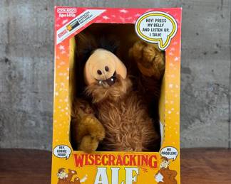 Wisecracking ALF talking plush manufactured by Coleco. Includes phrases activated by pressing the belly. Still housed in the original packaging, marked for ages 4 and up. Box shows some visible wear but is intact, and the toy appears unused.