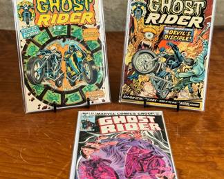 Three issues of Marvel Comics Group’s Ghost Rider comic books. Issues include #8 (October, 25 cents), #7 (25 cents), and #44 (40 cents). Covers feature dynamic illustrations of the Ghost Rider character.