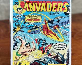 A first issue of Marvel Comics Group’s, “The Invaders, ” published in August 1975. Featuring The Invaders in bold World War II conflicts, this comic is an iconic start to the series, with vibrant and well-preserved cover art. The issue showcases characters such as Captain America and Human Torch.