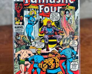 Fantastic Four issue #104 by Marvel Comics, published in November 1970. The 15-cent comic features artwork and storytelling characteristic of the Bronze Age of comics. The cover prominently showcases Magneto and the Fantastic Four team, including The Thing and Invisible Woman. Presented in a clear protective sleeve.