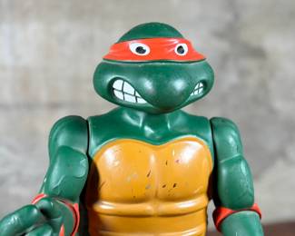 1989 Playmates Toys Teenage Mutant Ninja Turtles action figure representing Michelangelo.