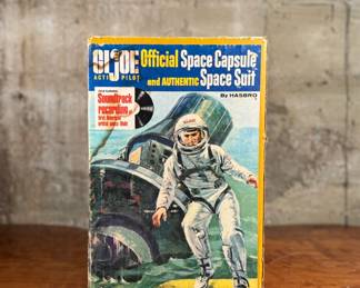 G.I. Joe Official Space Capsule and Authentic Space Suit by Hasbro, designed to fit the G.I. Joe action figure series. Includes original packaging, showing light wear commensurate with age. Features astronaut equipment, the space capsule, and a soundtrack recording of the first American space flight. G.I. Joe figure not included.