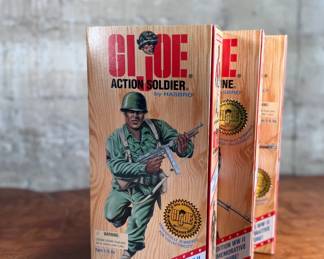 Five limited edition G.I. Joe WWII commemorative figures by Hasbro, including Action Soldier, Action Sailor, Action Marine, Action Pilot, and Dress Marine. Each figure is in its original themed packaging with accessories depicted on the box art. All packaging shows detailed design and preservation of classic military themes.