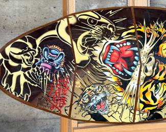 Ed Hardy skimboard featuring bold tiger-themed artwork and vibrant illustrations in signature style. Measures 40” H x 17.5” W and includes ’50-150 Weight Class’ labeling.