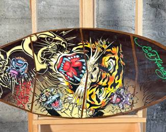 Ed Hardy skimboard featuring bold tiger-themed artwork and vibrant illustrations in signature style. Measures 40” H x 17.5” W and includes ’50-150 Weight Class’ labeling.