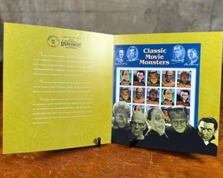 Classic Movie Monsters stamp collection commemorating iconic Hollywood characters. Includes a presentation folder with informational text and two sheets of stamps depicting monsters such as Dracula, Frankenstein, and more. Stamped with an issue date of September 30, 1997, at Universal City, California.
