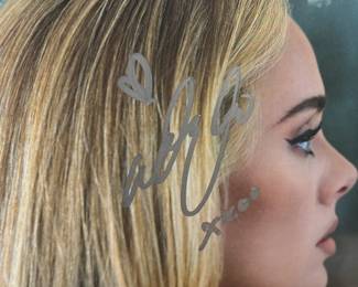 Factory-sealed copy of the album ’30,’ by Adele, signed on the cover in silver marker. Includes a tamper-proof holographic Heritage Authentication sticker and certificate of authenticity. Signature is clear and located on the artwork. A collectible for music enthusiasts.