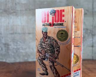 Five limited edition G.I. Joe WWII commemorative figures by Hasbro, including Action Soldier, Action Sailor, Action Marine, Action Pilot, and Dress Marine. Each figure is in its original themed packaging with accessories depicted on the box art. All packaging shows detailed design and preservation of classic military themes.