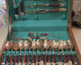 Mid-century vintage Thai brass flatware with rosewood handles in a teal-lined wooden case (2 sets).