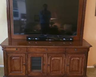 Wooden media console with Samsung 50" TV and soundbar