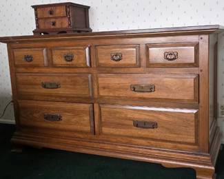 Solid wood dresser with four main drawers and four top drawers. Classic brass pulls.