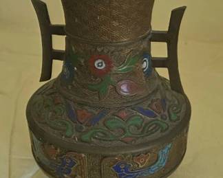 Cloisonné vase with a bronze base, featuring intricate multicolored enamel designs of flowers, dragons, and scrolling motifs in traditional Chinese style, complete with decorative handles.