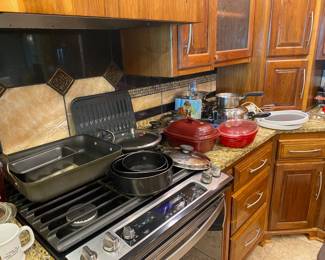 Miscellaneous kitchen items including set of Permanent Cookware.