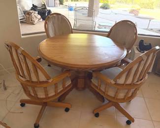 Round Wooden Dining Table  4 Rolling Chairs