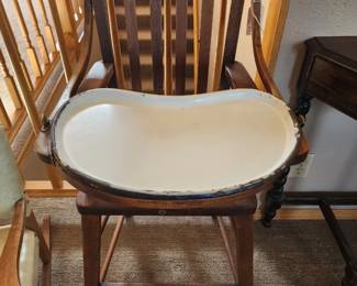 Antique high chair with metal tray