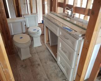 Kohler commodes; beautiful bath vanity