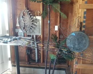 Fishing rods; lighted palm tree; high top table