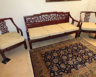 Three piece Asian Rosewood furniture. Highly carved back rests and silk cushions.