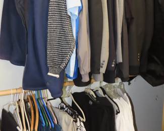 Mens clothing, tables of new with tags clothing.