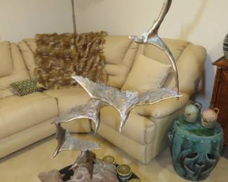 Curtis Jere, flying birds sculpture on gnarled wood.