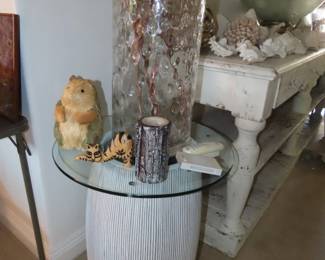 large planter container with glass top and large glass container with fake stems.