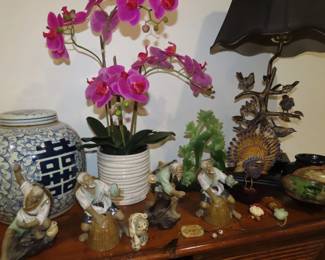 Mudmen, jade and bone like netsukes. Bird themed table lamp and very large old ginger jar.