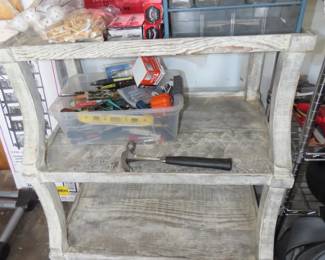 Wooden kitchen shelves, tool kits, golf balls.