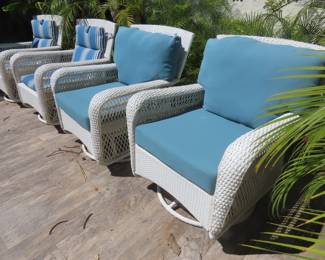 Four swivel resin patio chairs
