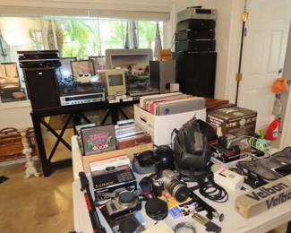 Office area. Stereos, cameras, rosewood furniture.