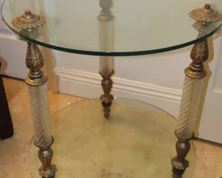 Hollywood Regency two tiered glass cocktail table.