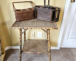 Bamboo and rattan side table with woven top and lower shelf, paired with coordinating woven storage caddies/baskets.