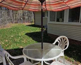 Table and chairs patio set with umbrella